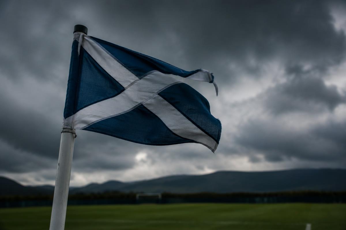Corner flag whipped by the wind at a Scottish ground