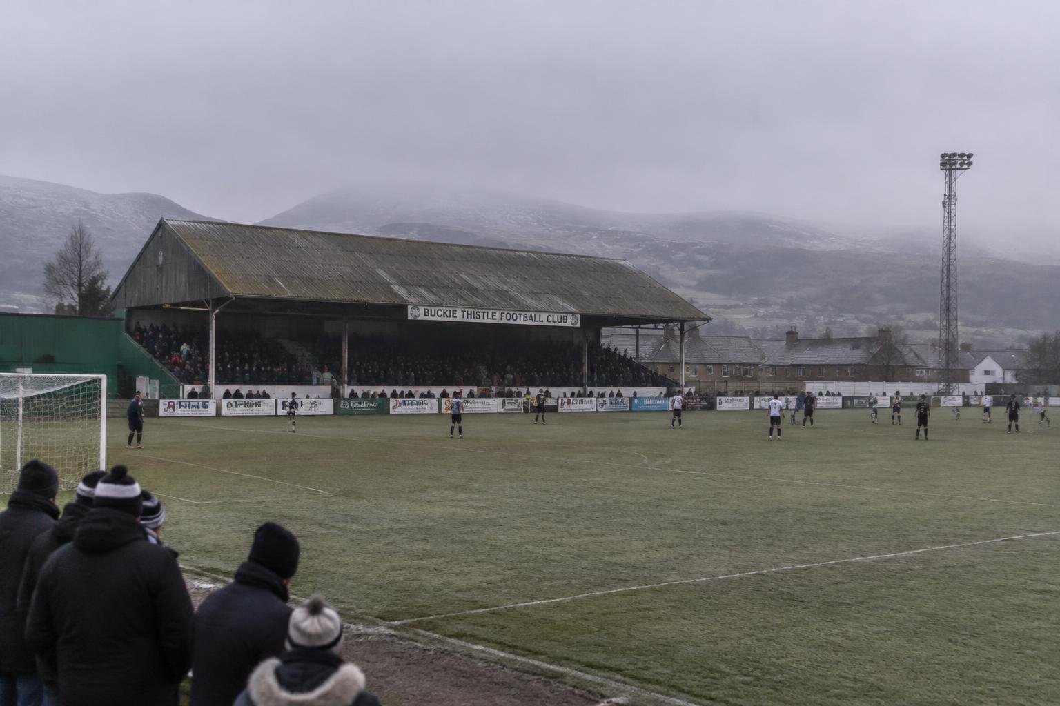 Remote Highland League pitch surrounded by hills